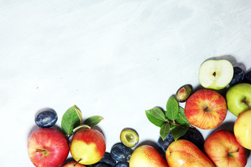 Various fresh fruits. Thanksgiving apples, and pears on rustic background.