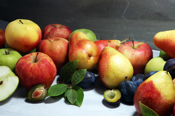 Various fresh fruits. Thanksgiving apples, and pears on rustic background.
