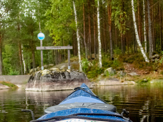 Obraz premium Kayaking on the calm Saimaa lake in Finland - 10