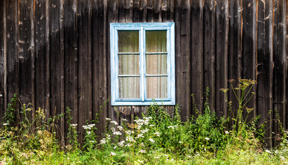window in the old wooden house in the Carpathians