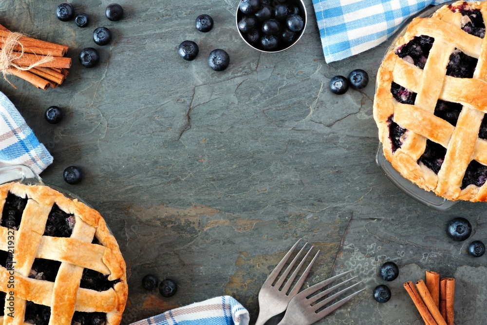 Aufkleber rustic homemade blueberry pies with lattice pastry. top view scene. frame with copy space over a dar