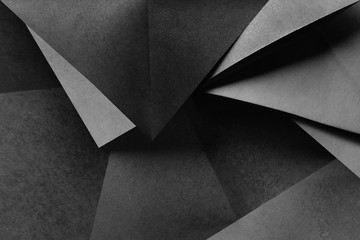 Conceptual composition with black geometric shapes, abstract background