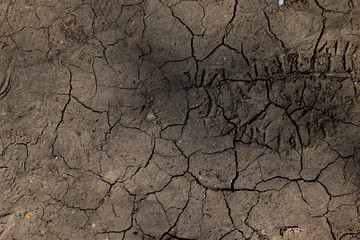 Footprint On Cracked Dry Ground Texture