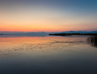Fototapeta na wymiar Sunset colors reflecting on Vistonida Lake, Komotini, Greece