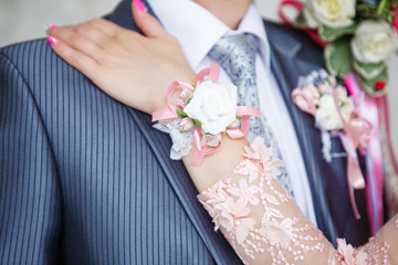 Ornaments of the bride and groom in details. Bracelet of the bride