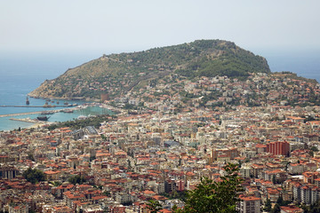 Obraz premium Panorama of the city. Numerous houses of the coastal city. The view from the height of bird flight.