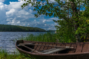 Old wooden rowing boat on the shore of the Saimaa lake in Finland - 9
