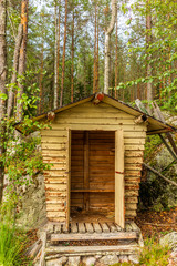 Fototapeta na wymiar Deatil of an old wooden changing cabin on the shore of the Saimaa lake in Finland - 1