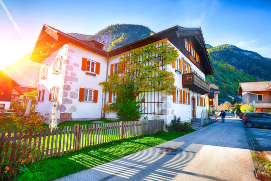 Scenic view of famous Hallstatt viilage. Typical Austrian Alpine houses with bright flowers