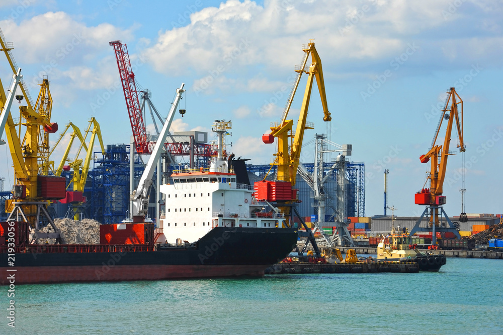 Wall mural bulk cargo ship under port crane