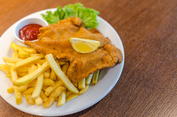 Schnitzel with french fries and salad