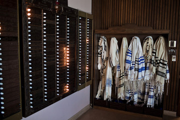 A Bunch of Tallits Hanging on a Wall in a Synagog