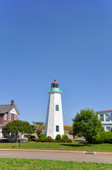 Old Point Comfort Lighthouse and keeper`s quarters in Fort Monroe, Chesapeake Bay, Virginia, USA.