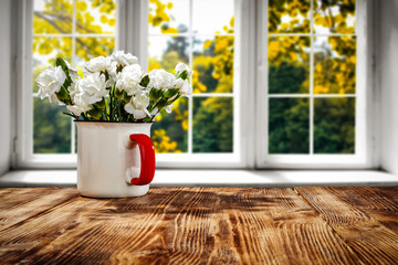 Fototapeta na wymiar Desk of free space and autumn background with window 