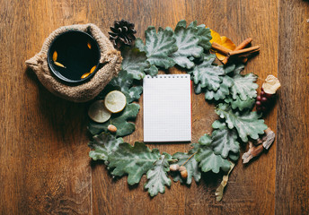 Thanksgiving autumn place setting with cutlery and arrangement of fall leaves. Restaurant menu of autumn drinks. Mockup