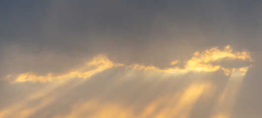 sunbeam behind clouds