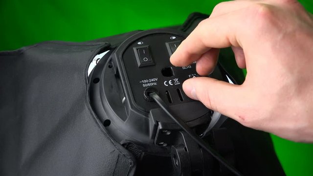 Specialist turns off electricity on the softbox and adjusts the voltage.