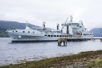 Grey battleship British royal fleet docked at naval base in Scotland