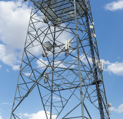 Communications tower with blue Cloud sky background