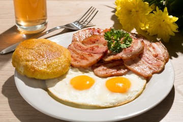 Breakfast with Fried Egg and Cutlets on the Table