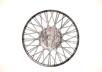Silver and black wheel on a white