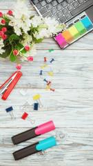 stationery, flowers and laptop