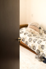 Half open door of a hotel bedroom or apartment