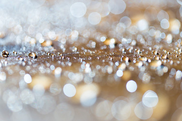 background bokeh, a drop of water golden flowers during sunset