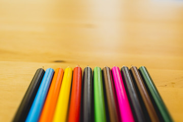 Fototapeta premium Colored pencils ordered to paint at school.