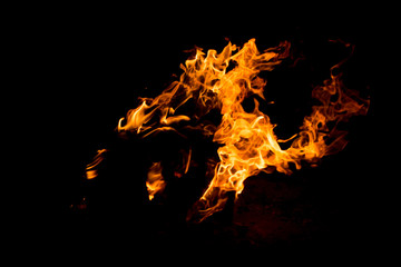 Flame of fire with sparks on a black background