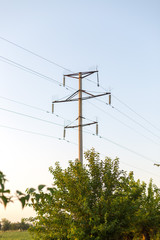 Obraz premium Electrical pole and wires against the sky