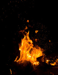 Flame of fire with sparks on a black background