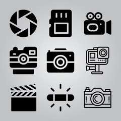 Simple 9 icon set of camera related video camera, film, memory card and action camera vector icons. Collection Illustration