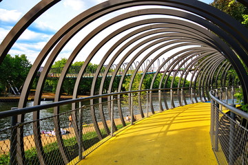 Inner view of Slinky Springs to Fame, famous pedestrian bridge enclose with spring alike structure,...