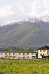 Naklejka premium mountains and houses from afar