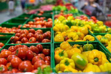 Various vegetables - sweet peppers and tomatoes in the supermarket