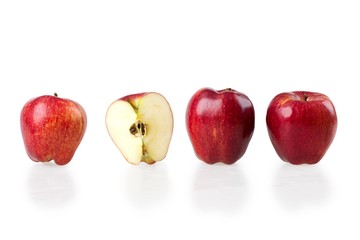 Line of apples with one apple cut in half