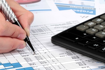 Man Analyzing Financial Reports Close-up
