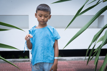 Little asian boy sick and sad