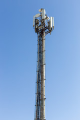 communication tower on blue sky background