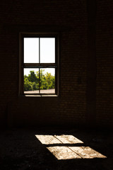 Old brick windows from inside the building and sunlight