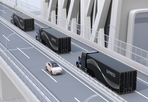 A fleet of black self-driving Fuel Cell Powered American Trucks driving on highway. 3D rendering image.