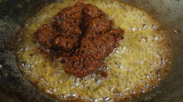 Frying chili paste in pan, Thai food