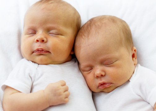 Identical Twin Infant Babies Cuddling