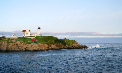 Fototapeta na wymiar nubble lighthouse on the island under sunlight