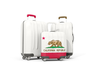 Luggage with flag of california. Three bags with united states local flags