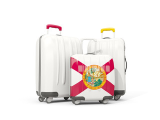 Luggage with flag of florida. Three bags with united states local flags
