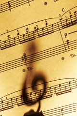 Clef on Background of Music Sheet