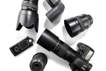 Digital SLR Camera with multiple lenses, flash and a light meter