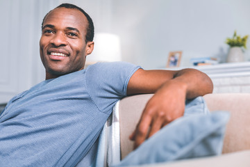 Obraz premium Day off. High-spirited man thinking while relaxing